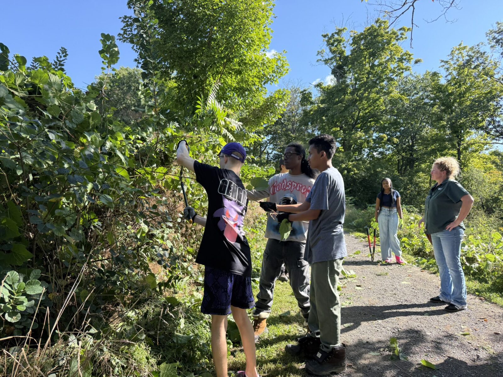 Kindness Club Students at Olana internship helping with landscaping and grounds keeping.